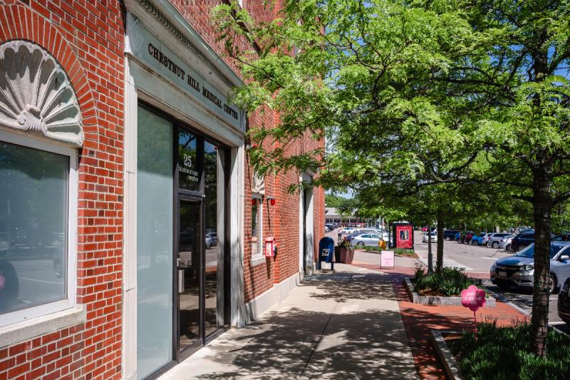 a empty street with a brick building